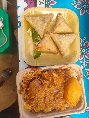 a plate of food with some food on a table at Sere n' Lukundo Park & Camping Services in Voi
