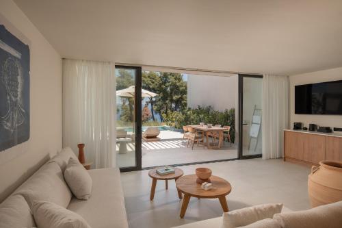 a living room with a couch and a table at Maritima Villas in Paliouri