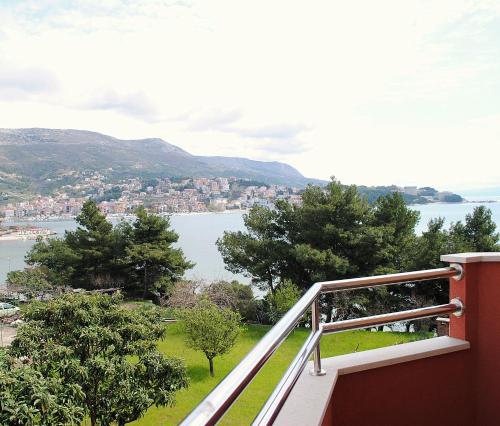 a balcony of a house with a view of the water at Rooms Split in Split