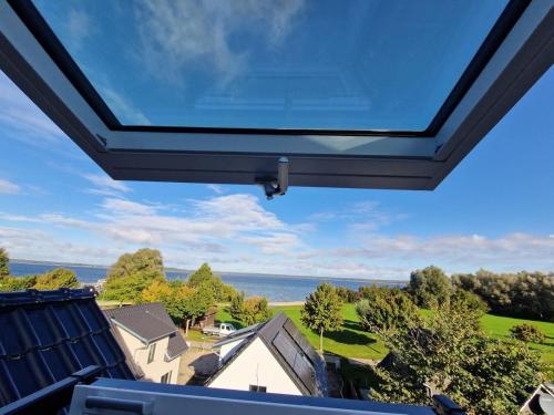 a view of the ocean from the balcony of a house at Villa Seeblick am Fleesensee in Göhren-Lebbin