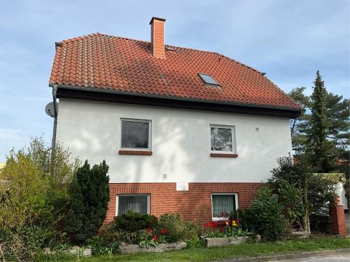a white house with a red roof at Wolff, Jürgen in Graal-Müritz