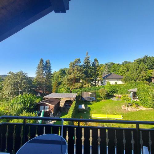 a view from a balcony of a house with a yard at Landhaus Brüne in Bad Wildungen