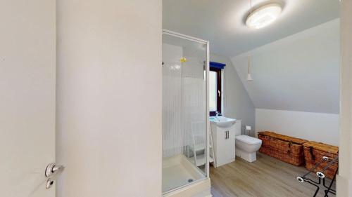 a bathroom with a shower and a toilet at 87 Strawberry Hill, Tolroy Manor in Hayle