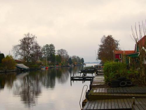 a river with a bunch of boats in the water at Ferienhaus Hieve in Marienwehr