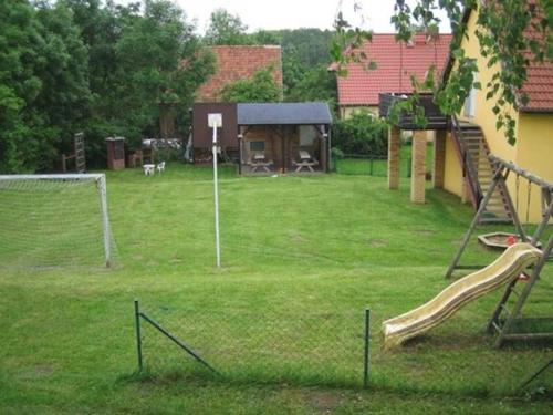 a park with a playground with a goal at Ferienwohnung am Kreßinsee in Strietfeld