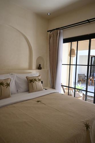 Tempat tidur dalam kamar di Koa Coco Casa