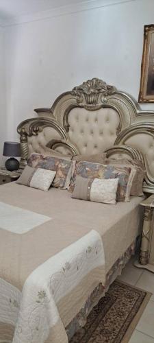 a pair of beds with pillows on them at Kettle Guest Lodge Rustenburg in Rustenburg