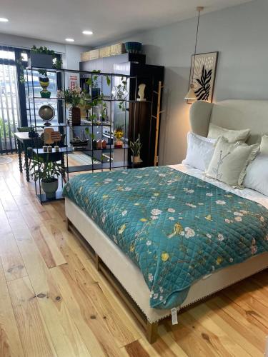 a bedroom with a bed and a dining room at Salina Ria Studio 2 in Aveiro