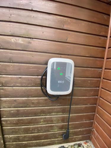 a small tv hanging on the side of a wall at Schlupfwinkel Mohnen Mit E-Ladestation in Clausthal-Zellerfeld