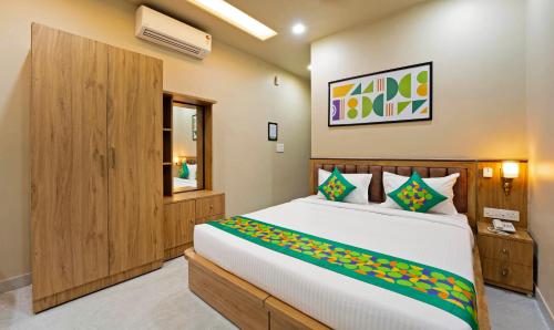 a bedroom with a large bed in a room at Anandam Hotel in Jaipur