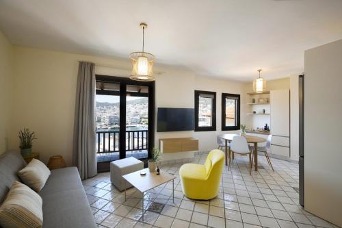 a living room with a couch and a table at ISTIO apartments in Kavála