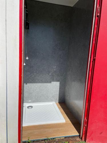 a door to a room with a toilet in it at Happy Meadows - The Chick Inn in Long Stratton