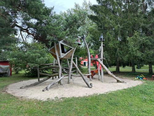 a playground in a park with a slide at Bed & Breakfast am Waldgürtel in Forst
