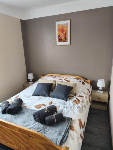 a bedroom with a bed with pillows on it at point baie studio 1 in Abbeville
