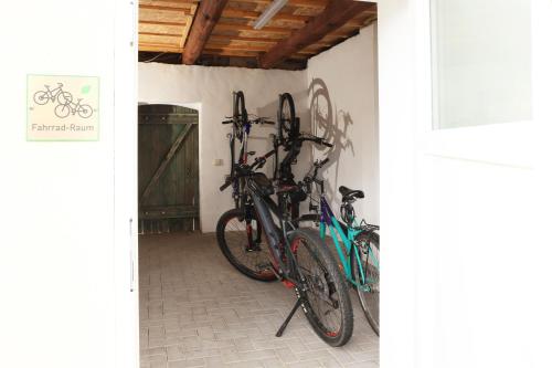 two bikes are parked next to a wall at SeeNest Lieske in Lieske