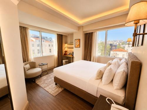 a hotel room with a bed and a window at The Tram Karakoy in Istanbul