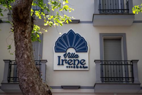 a sign on the side of a building at Hotel Villa Irene & Spa in Rimini