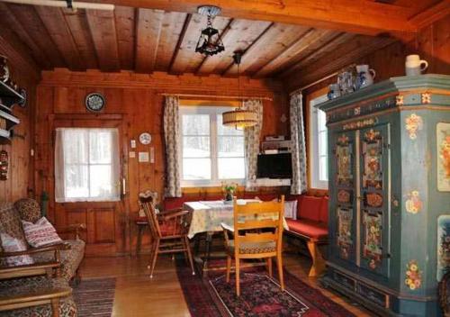 a dining room with a table and chairs at Ferienhaus Pilz Marion in Bad Goisern