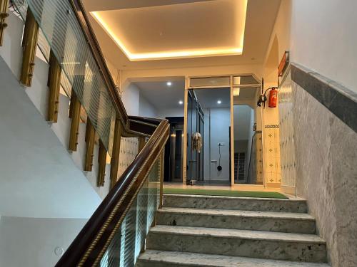 a staircase in a building with a glass floor at Hotel Umang in Sītāmarhi