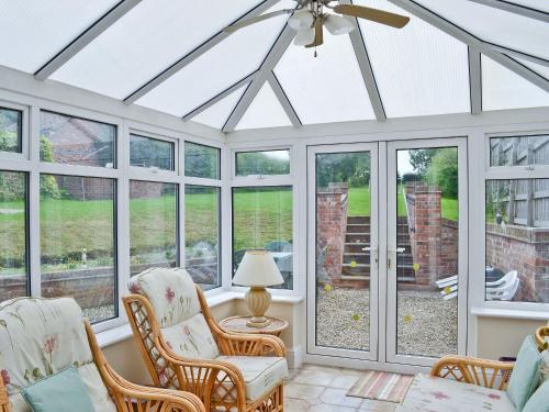 a conservatory with a conservatory ceiling with glass doors at No 2 Flowery Bank in Malton