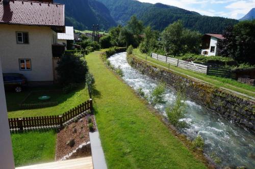 a view of a river from a house at Der Steinadler in Umhausen