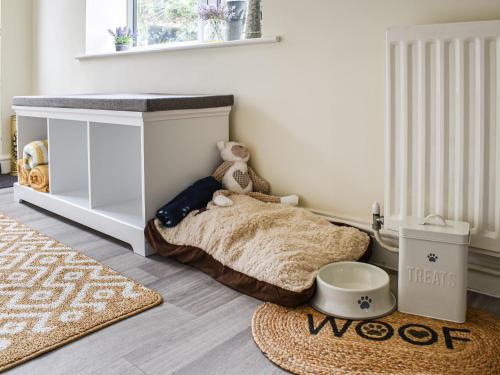 a childs bedroom with a bed and a rug at Brynfields in Ashbourne