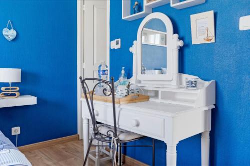 a bathroom with a white sink and a mirror at Chambre Saint-Samson-Sur-Rance in Saint-Samson-sur-Rance