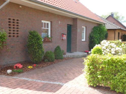 a house with a brick walkway in front of it at Ferienwohnung_Beethovenstrasse in Westerstede