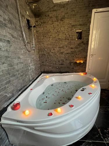 a bath tub with lights on it in a bathroom at Cairo Center in Cairo