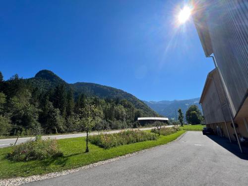 a view of a road with mountains in the background at Apartment Kanisfluh in Mellau