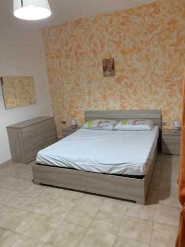 a bedroom with a bed in a room at Delfino in Letojanni