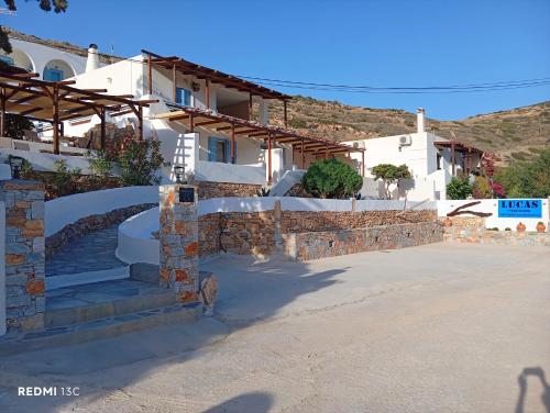 a building with stairs and a stone wall at Lucas B Panorama in Sikinos
