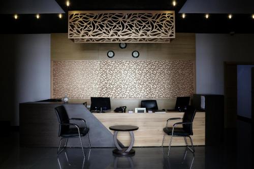 a waiting area with two chairs and a table at Hotel A44 in Tetouan