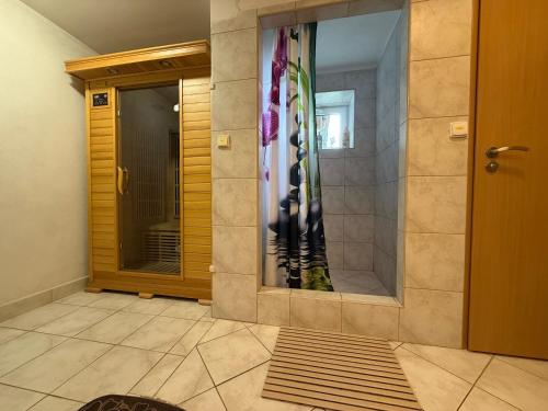 a front door of a house with a shower curtain at Rašovka - Bílý dům in Šimonovice