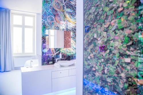 a bathroom with a sink and a mirror at Hotel Alte Post Flensburg in Flensburg