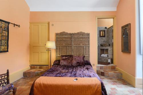 a bedroom with a bed in a room at Domaine du chemin Royale in Saint-Germain