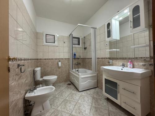 a bathroom with a sink and a toilet and a sink at S Pearl Lux in Utjeha