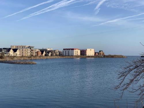 a large body of water with buildings in the background at Residenz Bollwark 2 2 in Olpenitz