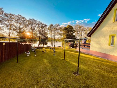 a group of people playing soccer in a yard at FEWO Am Haussee Feldberger Seenlandschaft in Feldberg