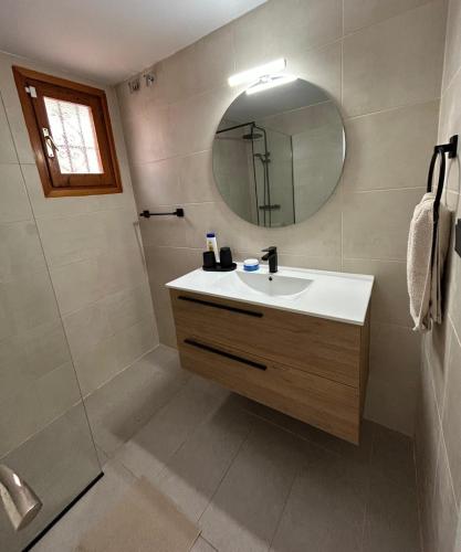 a bathroom with a sink and a mirror at Thelma house Tossa in Tossa de Mar