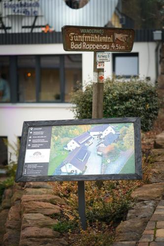 a sign with a map in front of a building at Siegelsbacher Muehle in Siegelsbach
