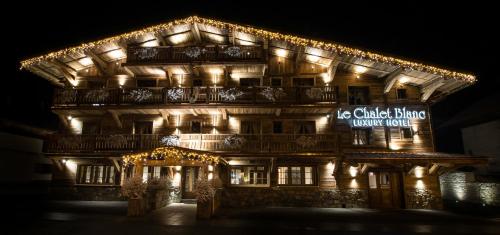 a lit up building with lights on it at Le Chalet Blanc in Megève