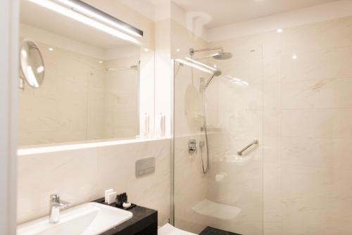 Ванная комната в Hotel Royal & Spa