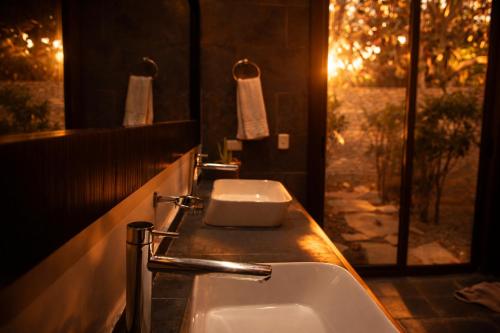 a bathroom with a sink and a toilet on a counter at Villa Alda Bávaro in Punta Cana
