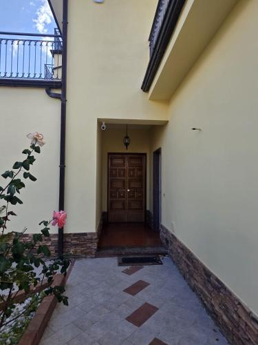 a hallway of a house with a wooden door at Villa Chiara in Piscopio