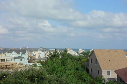 a view of a city with houses and trees at Shore is Fun - Duck, Poteskeet, Beach 480 Yds, 3 Min. Walk to Downtown, Pool, Hot Tub, YR Flex in Duck