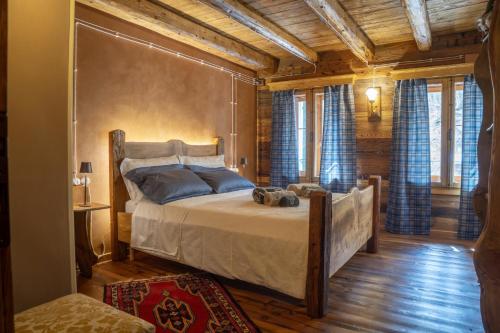 a bedroom with a large bed in a room at Ristoro la Crosetta in Caneva