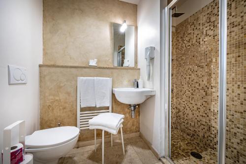 a bathroom with a toilet and a sink and a shower at Boutique Hotel La Casa di Morfeo in Florence
