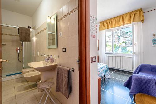 a bathroom with a sink and a shower at Artemisia in Varazze