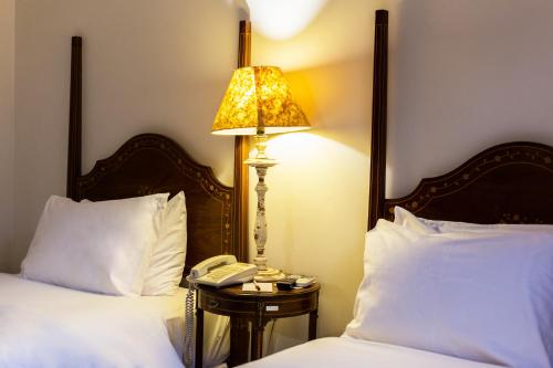 Кровать или кровати в номере Hotel Solar do Rosário